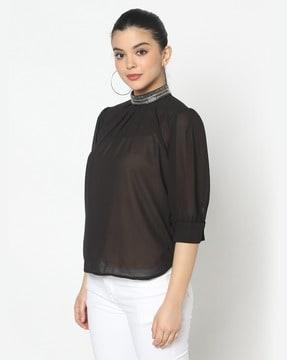 embellished top with back button closure