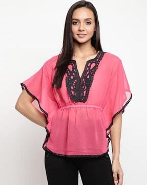 embellished top with tassels