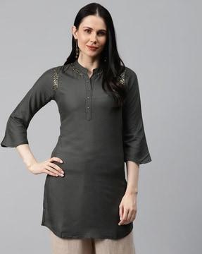 embellished tunic with curved hemline