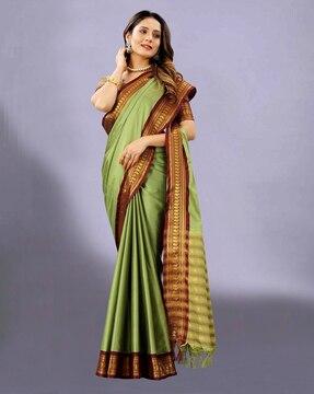 embellished woven golden zari border saree with tassels