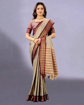 embellished woven golden zari border saree with tassels