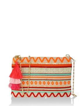 embellished wristlet with tassels