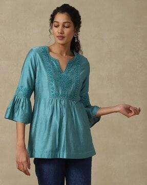 embroidered flared tunic with flounce sleeves