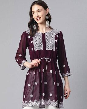 embroidered flared tunic with notched neckline