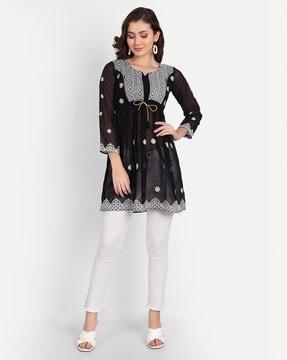 embroidered flared tunic with notched neckline