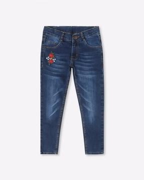 embroidered mid-wash jeans