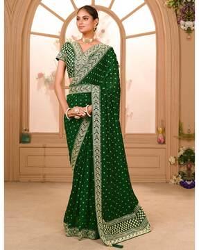 embroidered saree with contrast border & tassels