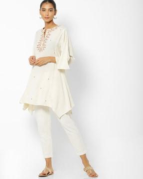 embroidered top with asymmetric hem