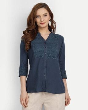 embroidered top with cuffed sleeves