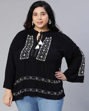 embroidered top with extended sleeves