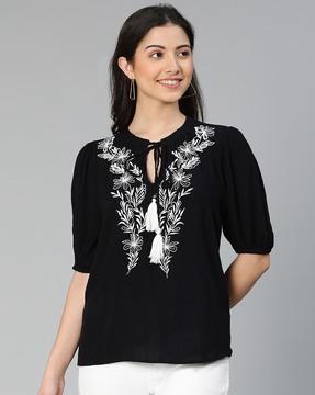 embroidered top with neckline tie-up