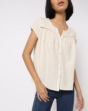 embroidered top with notched neckline