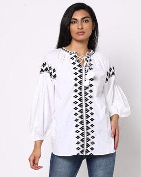 embroidered top with raglan sleeves