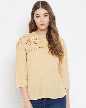 embroidered top with ruffled detail