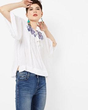 embroidered top with tassel tie-ups