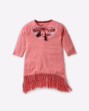 embroidered top with tasseled hemline