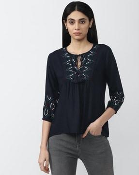 embroidered tunic top with neck tie-up