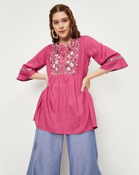 embroidered tunic with flared sleeves