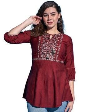 embroidered tunic with puff sleeves