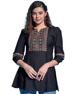 embroidered tunic with puff sleeves