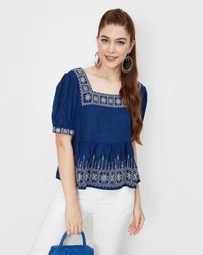 embroidered tunic with ruffle detail