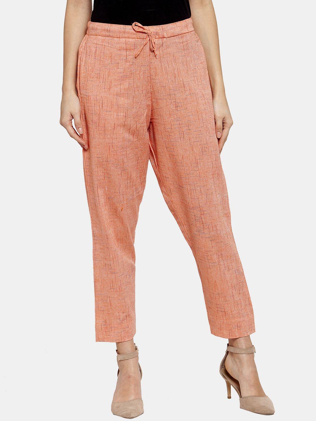 enchanted drapes women peach-coloured printed tapered fit cotton trousers