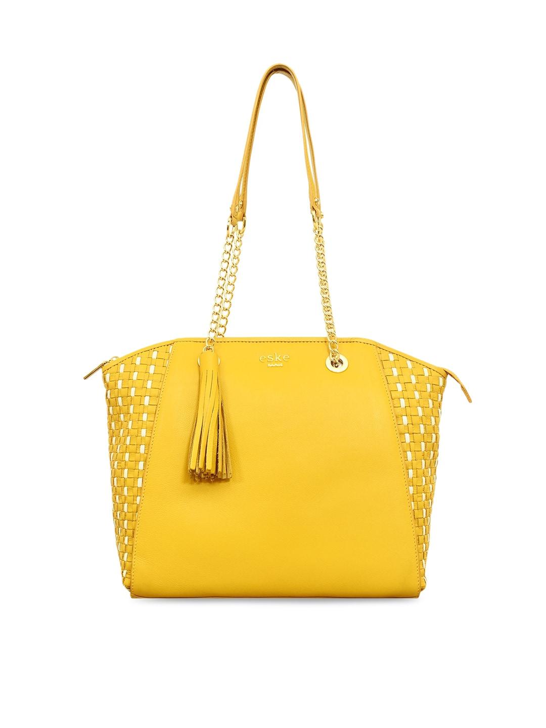 eske yellow leather structured shoulder bag with tasselled