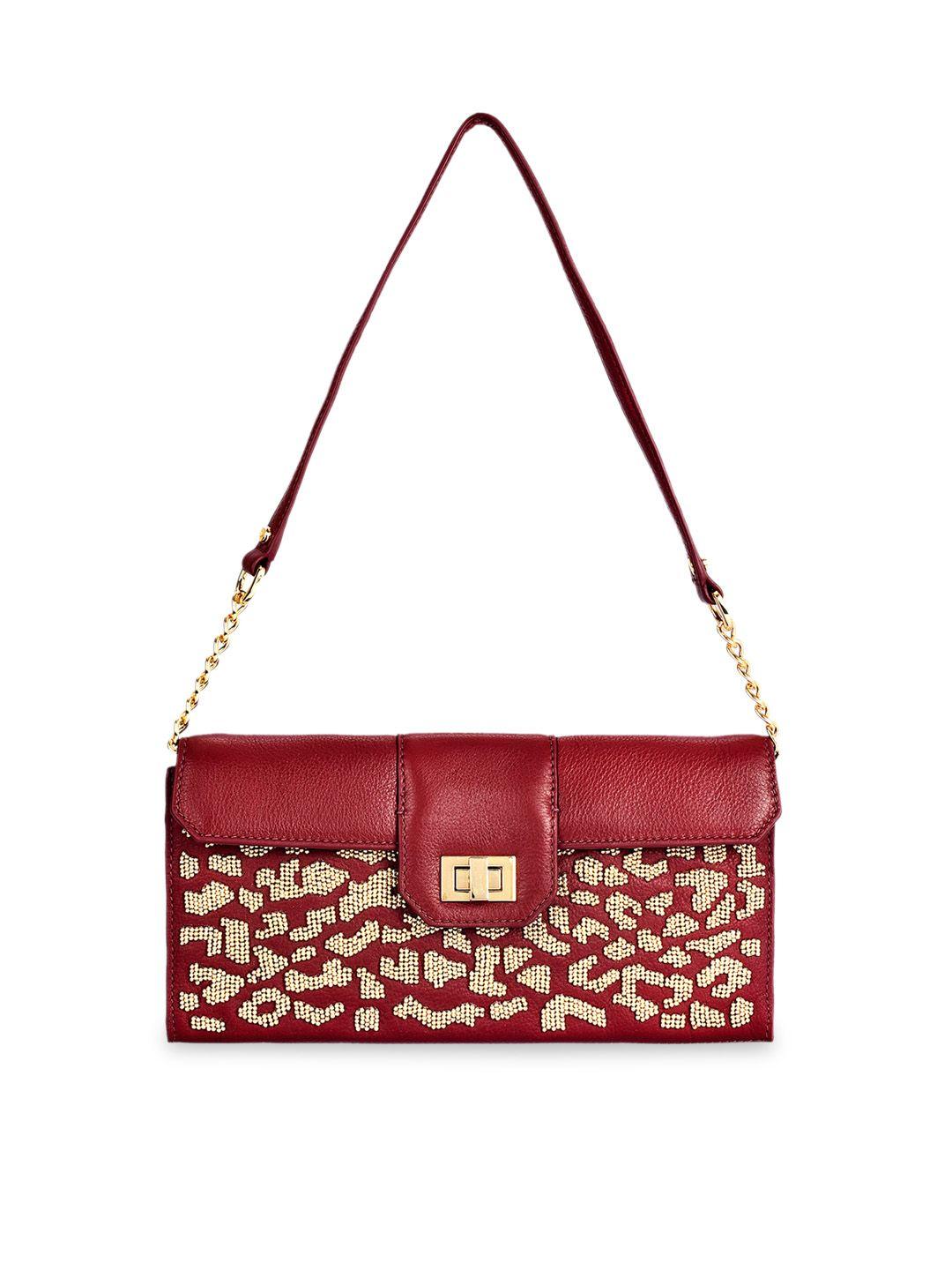 eske magenta embellished leather sling bag