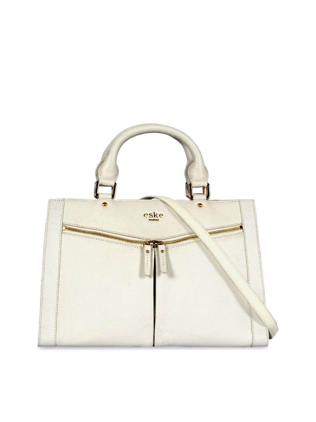 eske white leather structured handheld bag with bow detail