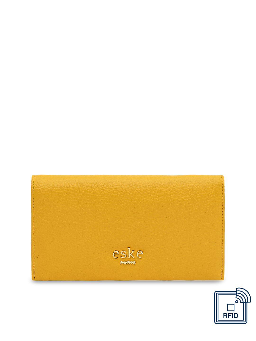 eske women yellow solid leather two fold wallet