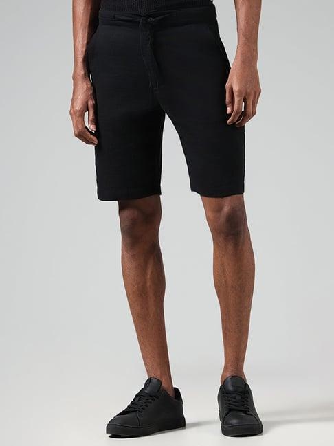 eta by westside solid black slim fit shorts