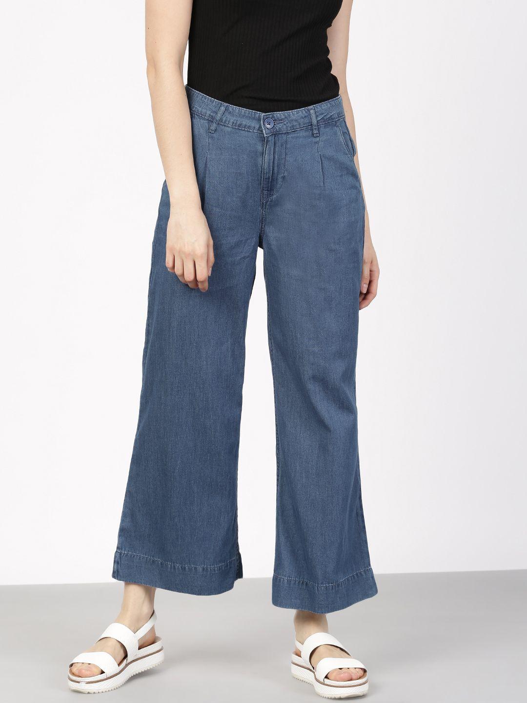 ether women blue washed denim flared trousers