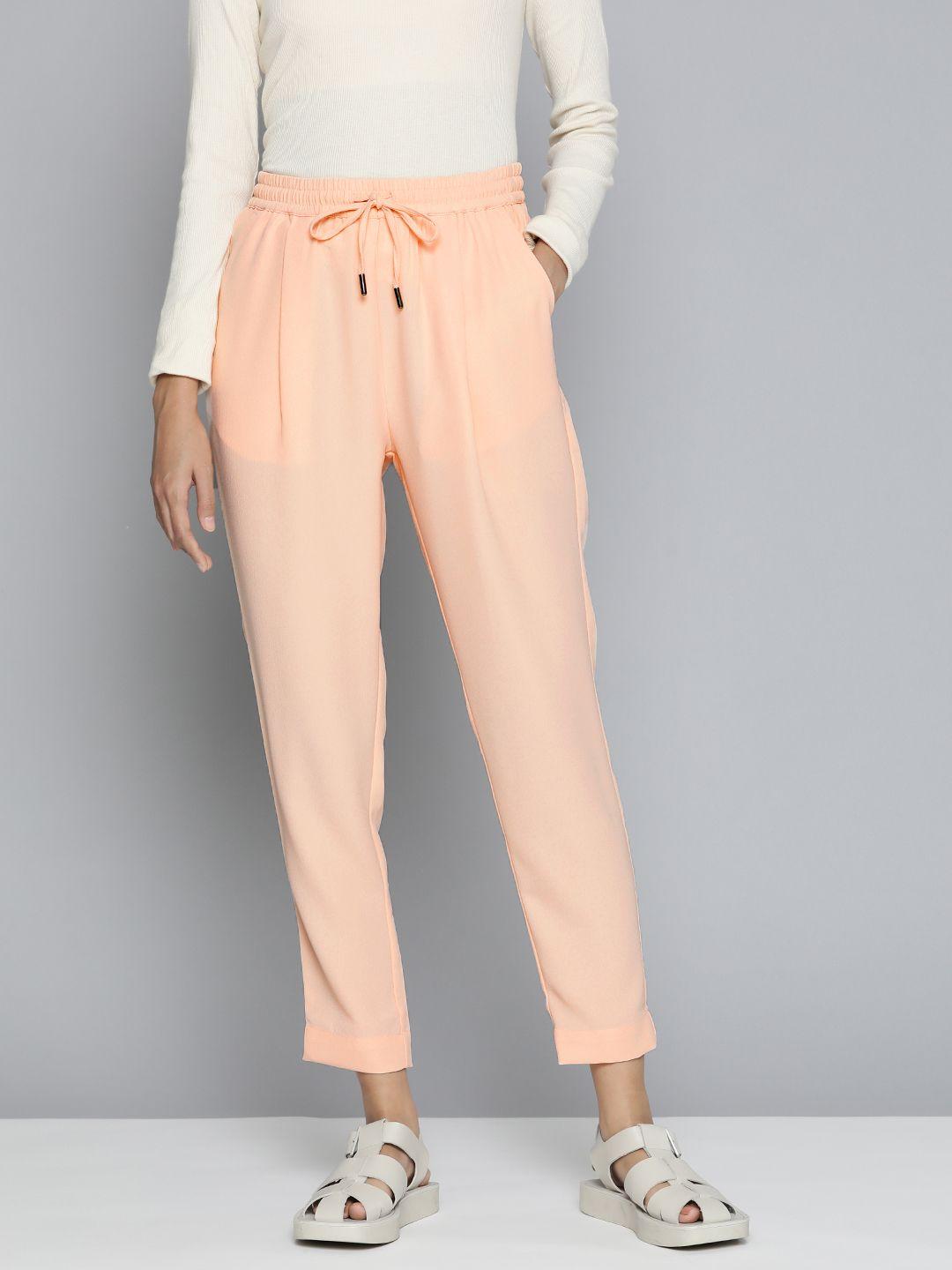 ether women peach-coloured solid regular fit trousers