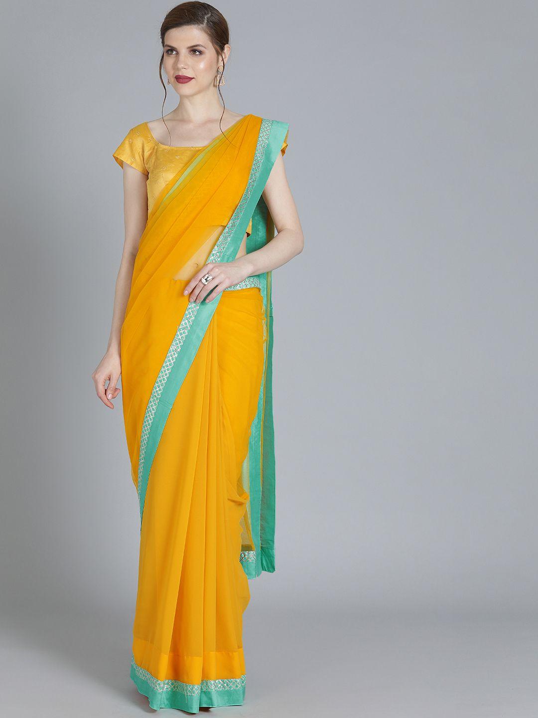 ethnovog mustard solid poly georgette saree