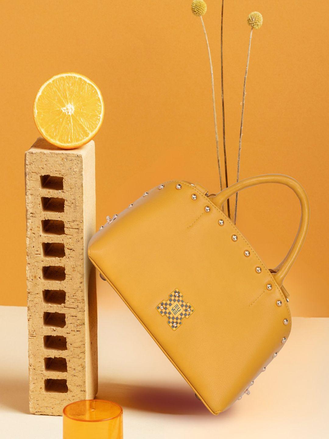 eume water resistent embellished structured handheld bag