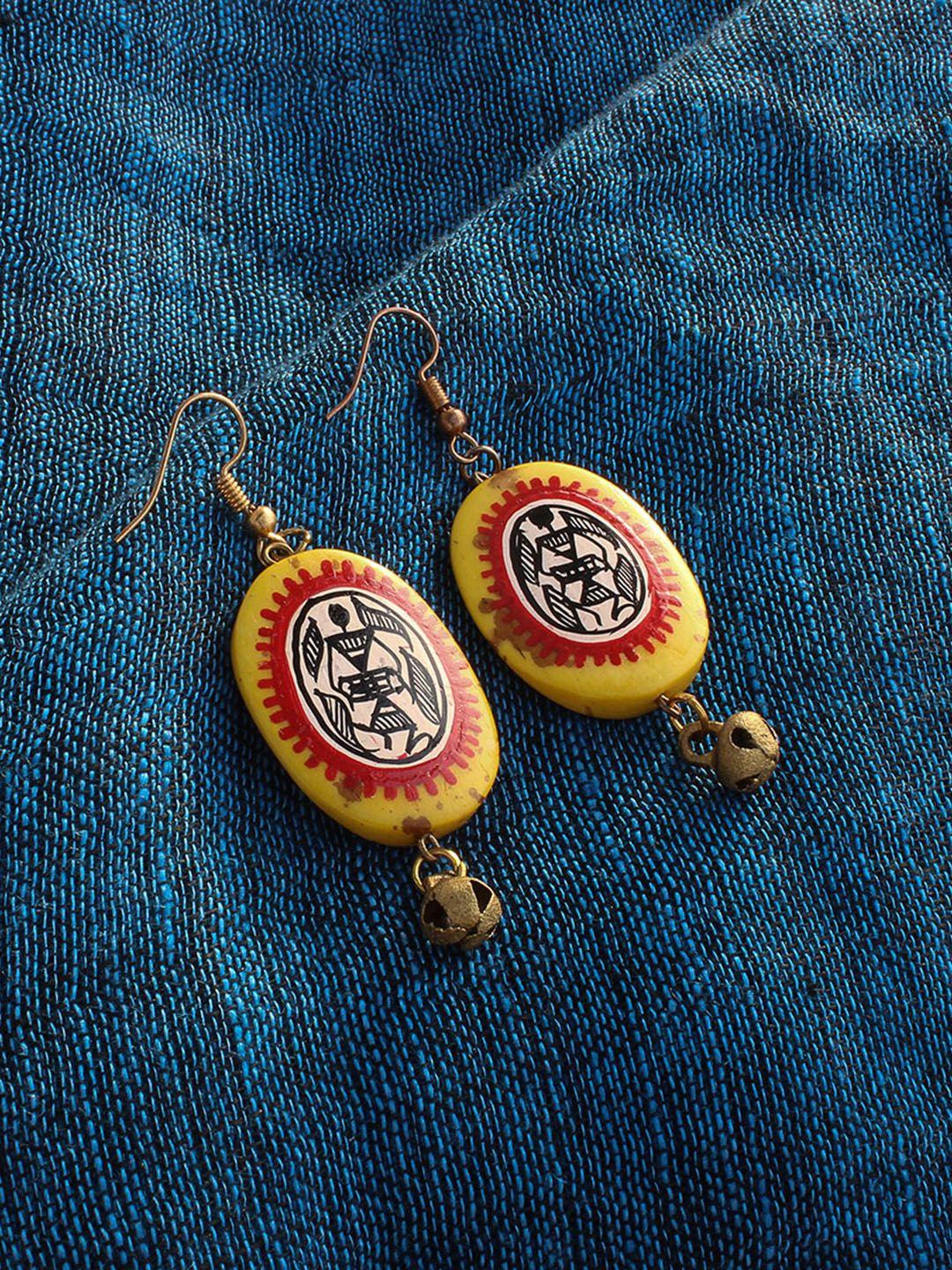 exclusivelane yellow & orange warli art hand-painted bohemian resin oval drop earrings