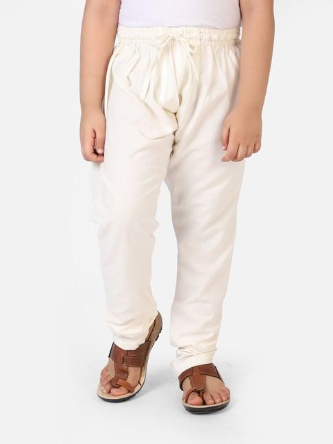 fabindia kids cream solid churidars