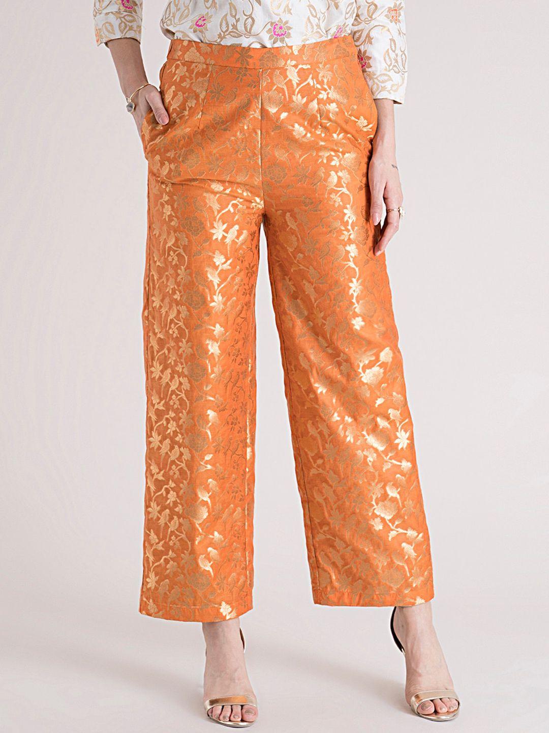 fablestreet women orange ethnic motifs printed loose fit parallel trousers