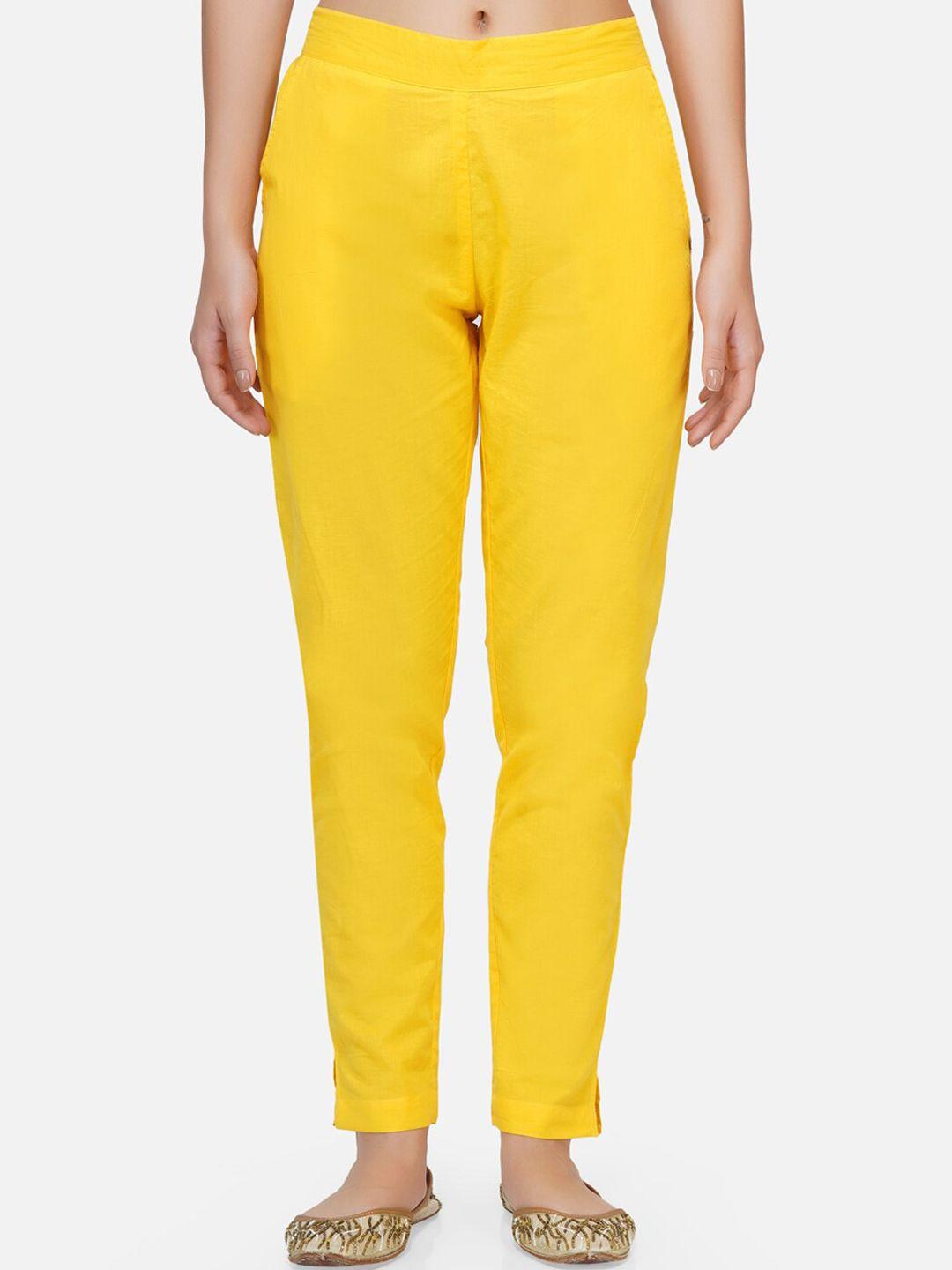 fabnest women yellow solid flat-front regular trousers