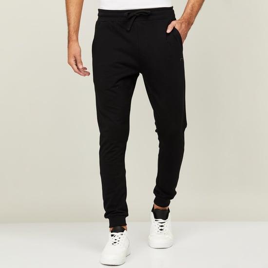 fame forever men solid slim fit joggers