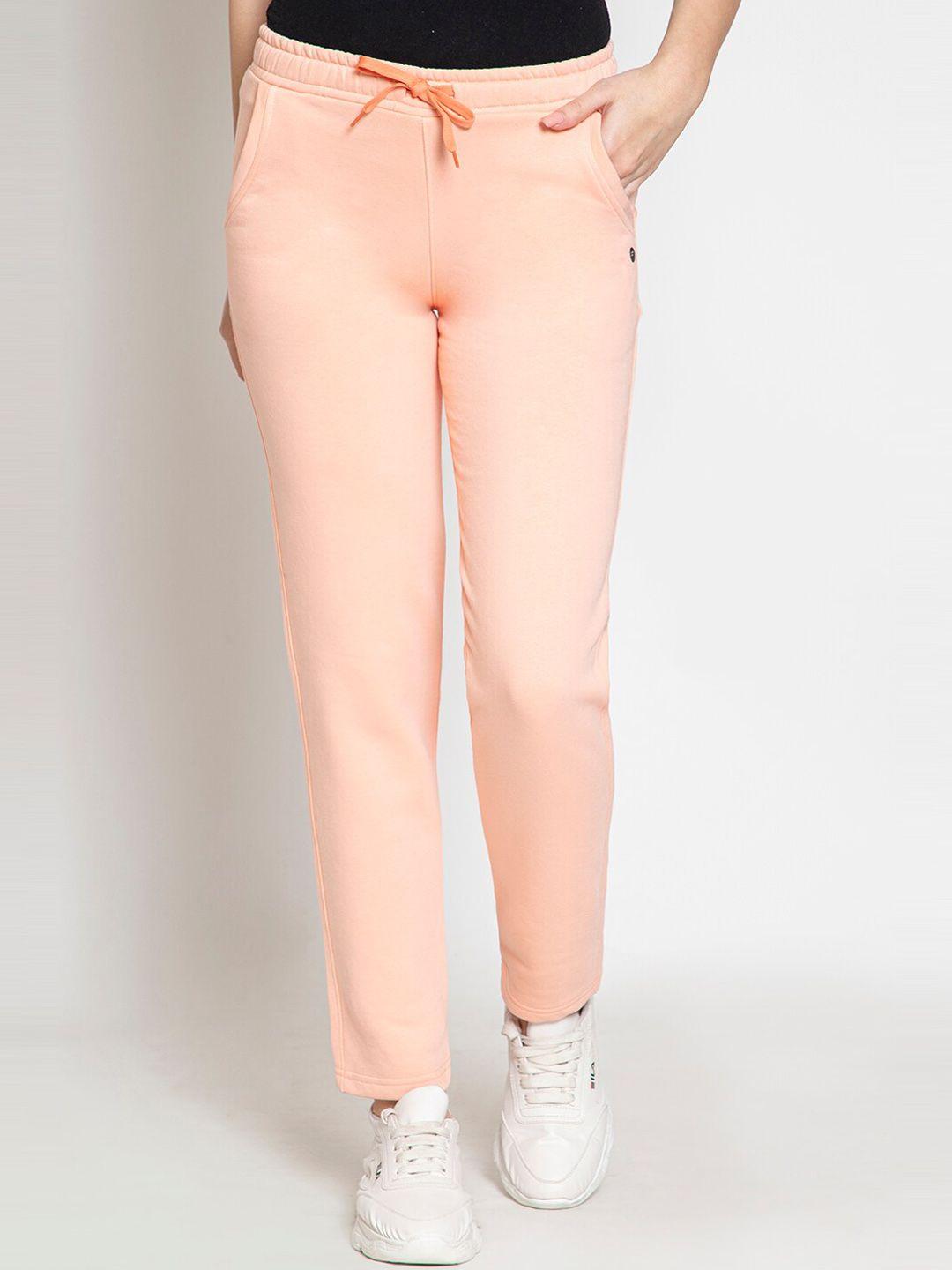 femea women peach-coloured solid cotton slim-fit track pants