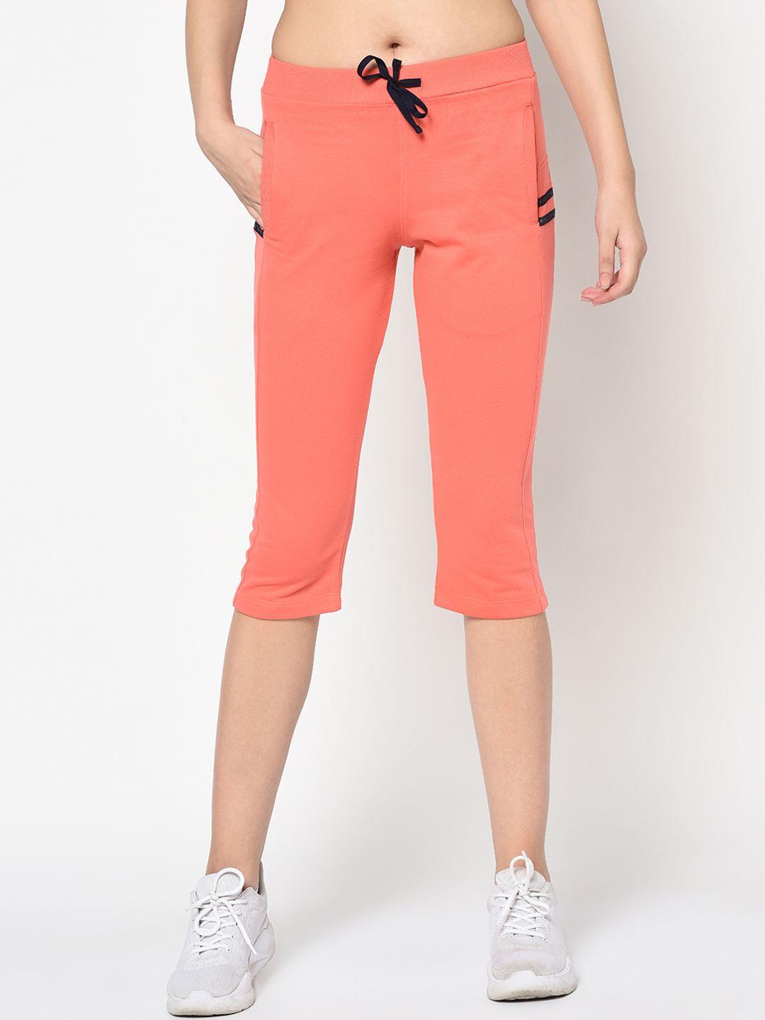 femea women peach-coloured solid slim fit capris