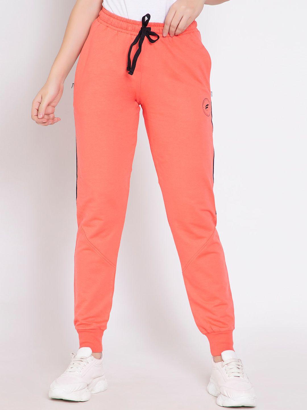 femea women peach-coloured solid slim fit joggers