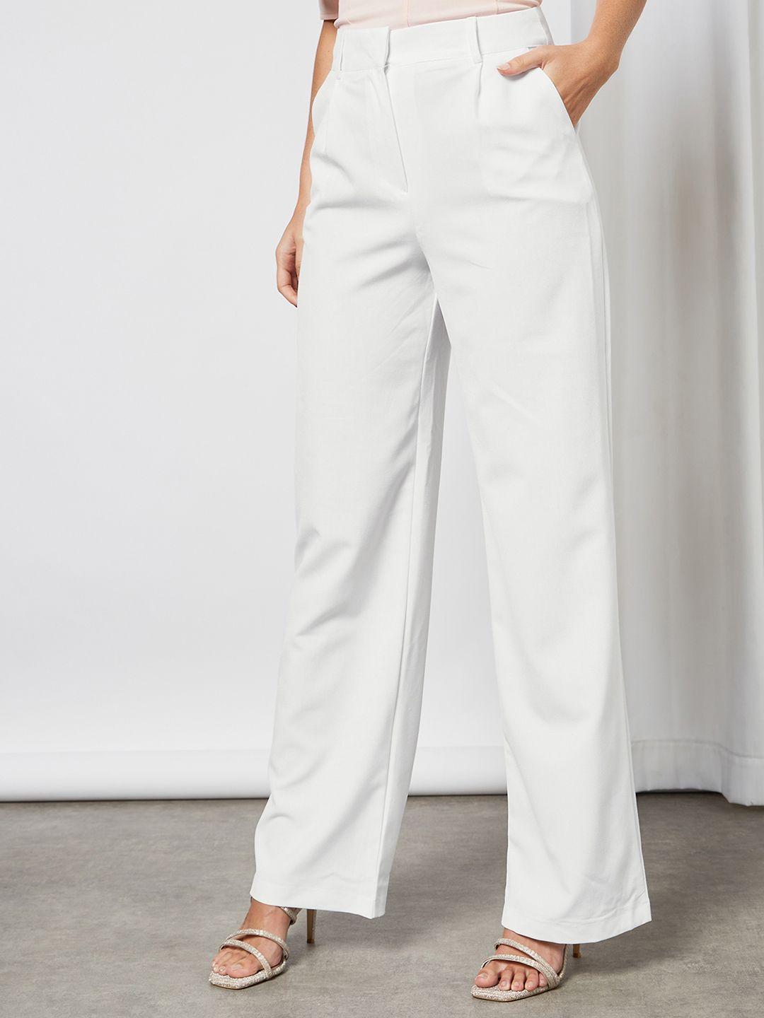 femme luxe women white solid pleated trousers