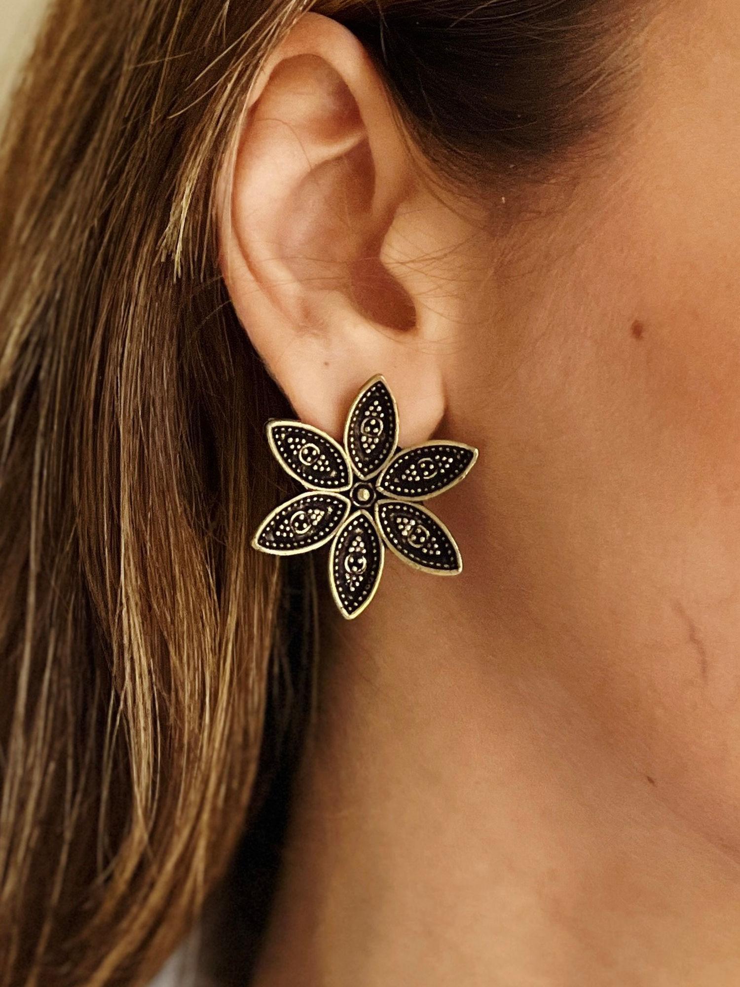 festive black and gold floral statement studs