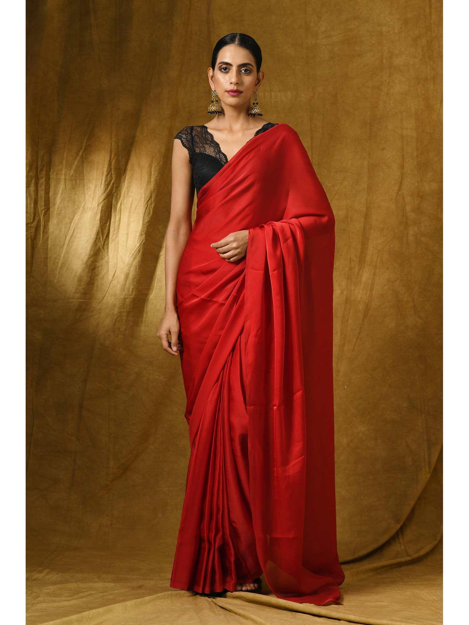 fiery red satin saree with gold pendants