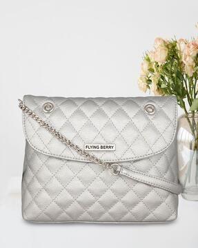 flap-closure quilted sling bag
