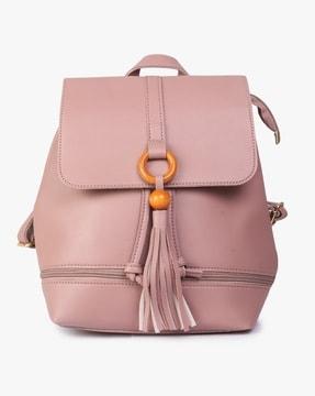 flap-over backpack with tassels