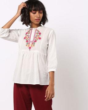 flared tunic with embroidered yoke