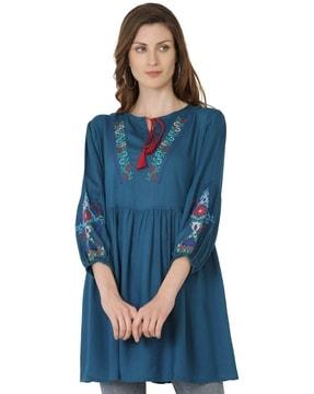flared tunic with embroidery